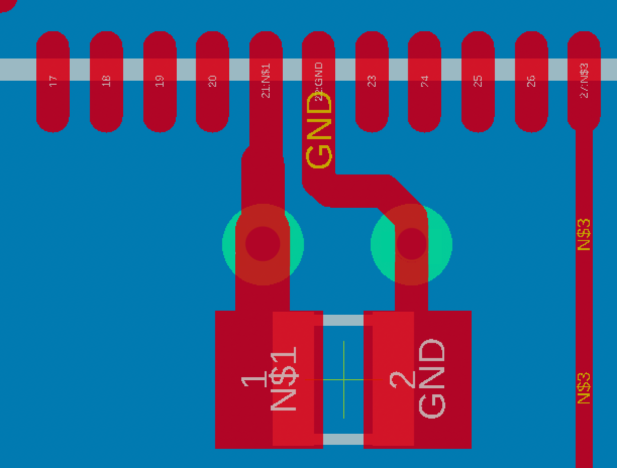 unnamed-(3).png This image illustrates how the left trace gets thinner as it merges into the IC pin. The figure also depicts how vias can be placed between a decoupling capacitor and the supply pins.<